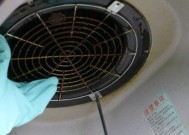 如何清洗无法拆下的油烟机滤网（解决油烟机滤网无法拆下的问题）